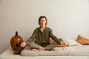 man practicing calming techniques