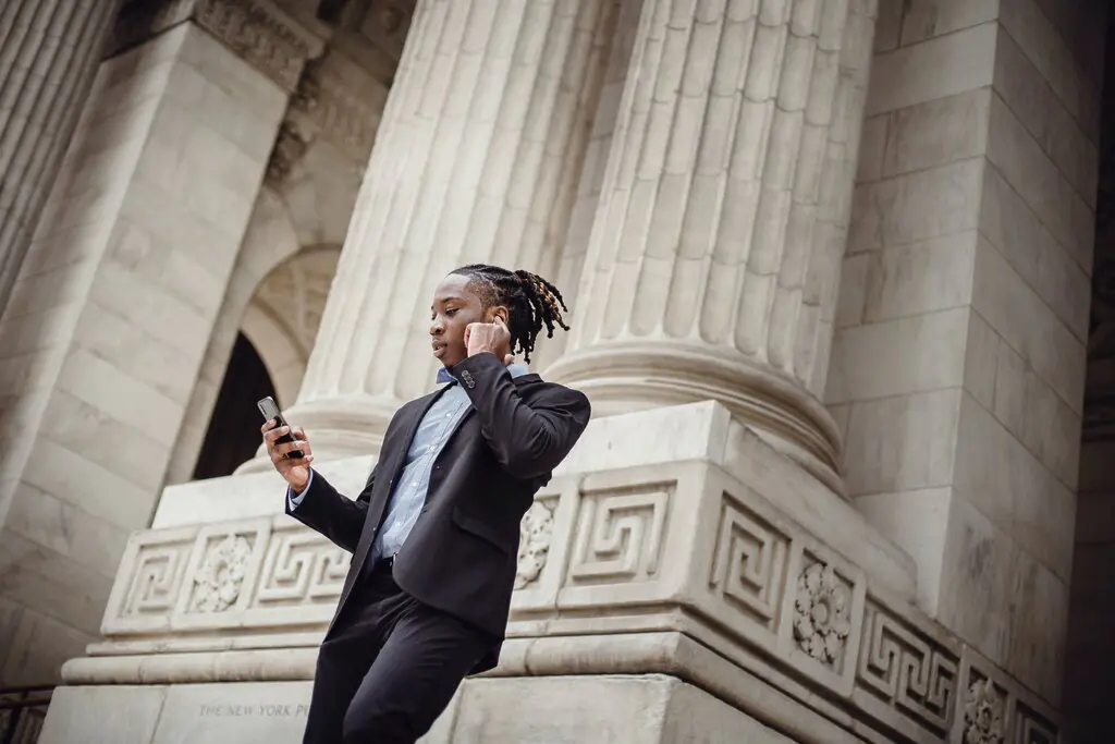 man on his phone in a suit