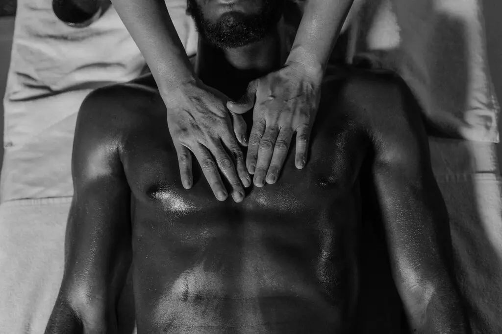 black man receiving a massage